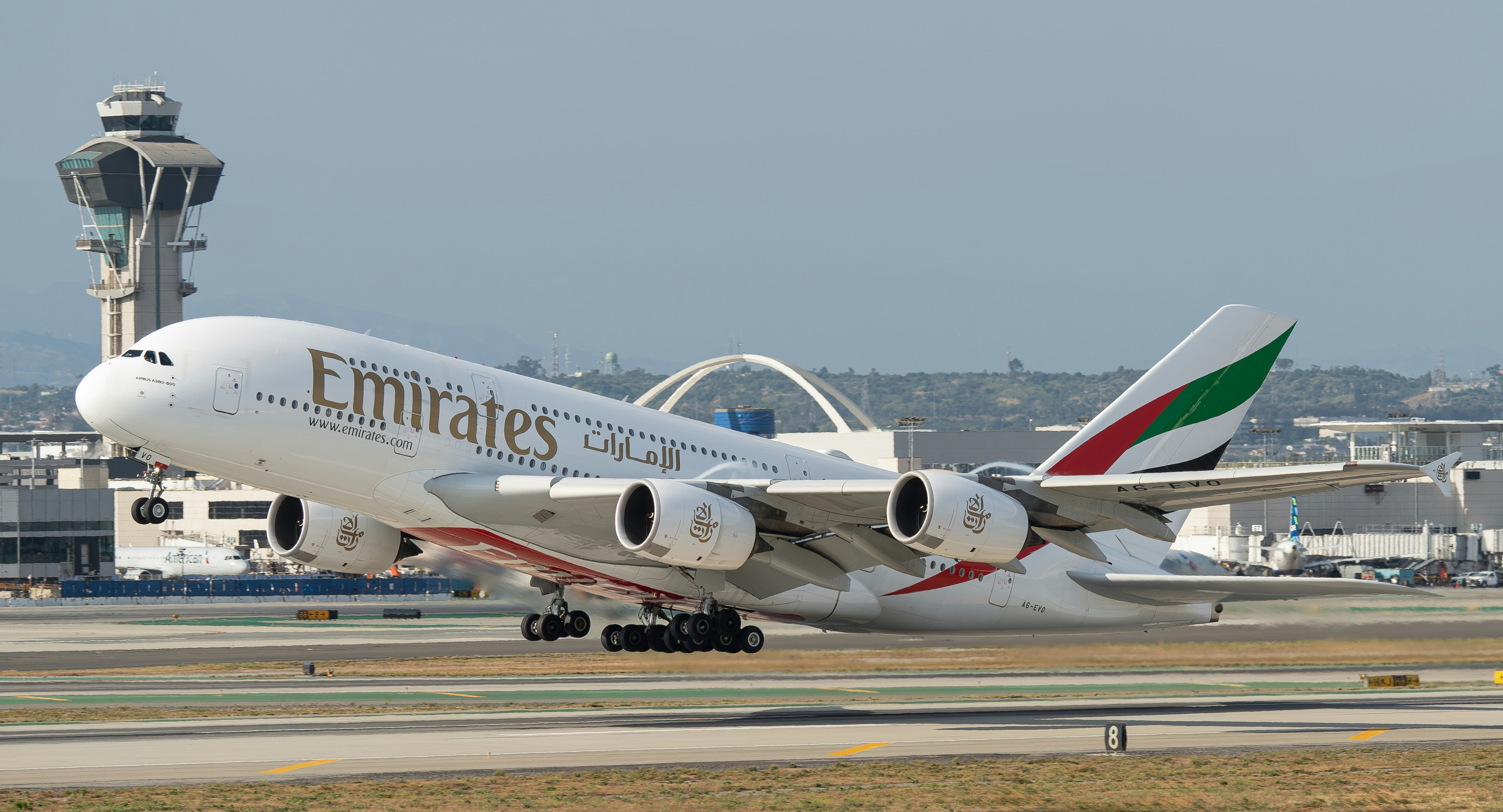 A large jetliner sitting on top of an airport runway
